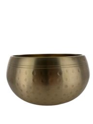 Bol chantant tibétain martelé d’environ 15 cm, finition dorée avec motifs martelés traditionnels, utilisé pour la méditation, la relaxation et les pratiques énergétiques.
