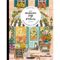 Couverture du livre Les moments cosy d'Olivia par Olivia Gibbs (Dessain et Tolra). Illustration colorée d'une boutique de fleurs accueillante avec un chat. 40 planches à colorier sur papier aquarelle de qualité.