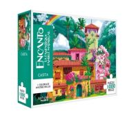 Boîte du puzzle mystère Disney Encanto – Casita 1000 pièces. Illustration colorée représentant la maison magique de la famille Madrigal entourée de végétation tropicale, fleurs roses et palmiers luxuriants. Le packaging vert turquoise affiche le logo Disn