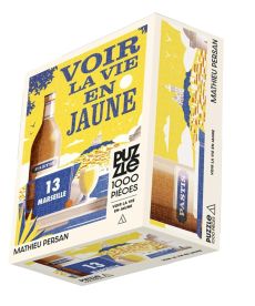 Boîte du Puzzle Voir la vie en jaune, collection Mathieu Persan chez Hachette. L'illustration vintage aux tons jaunes et bleus évoque Marseille avec une bouteille de pastis en terrasse. Un défi de 1000 pièces !