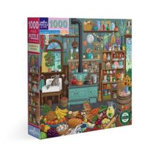 Boîte du puzzle Alchemist's Kitchen 1000 pièces de la marque eeBoo, photographiée en perspective sur un fond blanc. L'emballage présente une illustration colorée d'une cuisine d'alchimiste avec une cuisinière turquoise, des étagères remplies de bocaux, de
